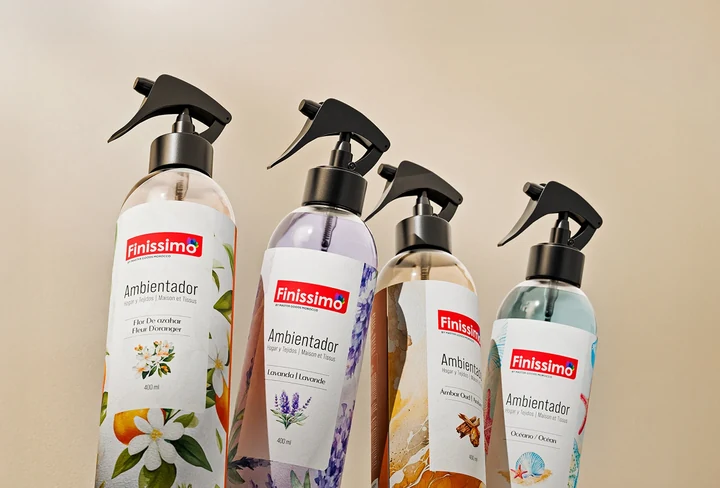 Four Finissimo home fragrance sprays on a warm beige background.