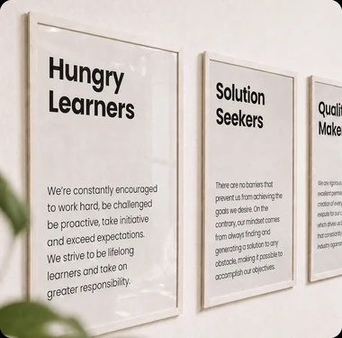 Framed studio principles on the Brandegree office wall