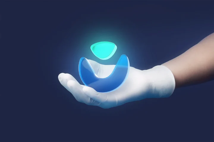 Vitae symbol hovering above a gloved hand.