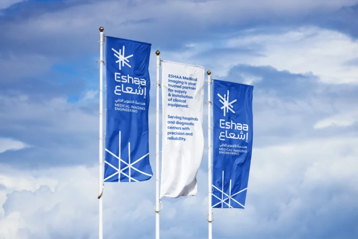Bilingual Eshaa flags outside.