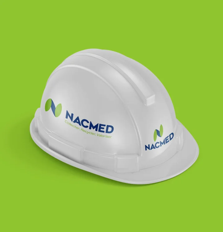 Nacmed identity applied to a white safety helmet.