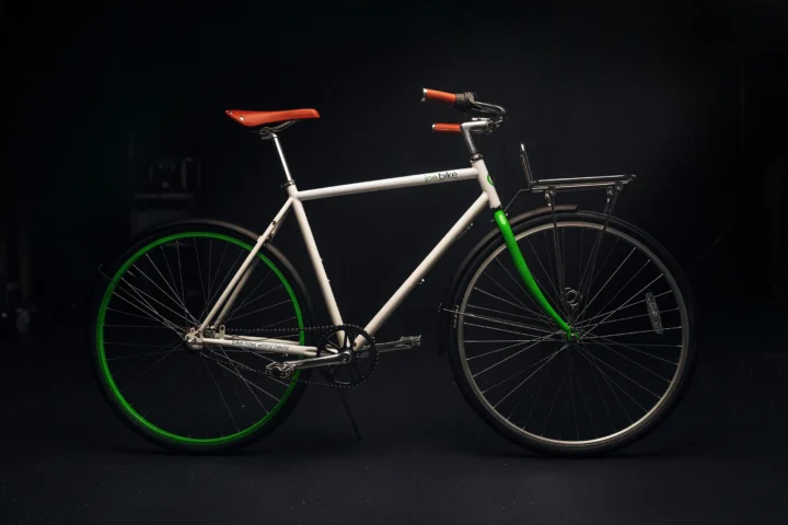 Complete white and green Joe Bike rental bicycle.